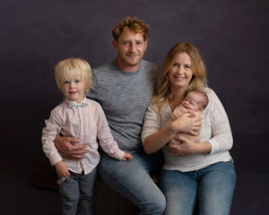 Family photograph, studio, grey background
