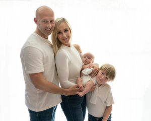Family portrait all styled in white