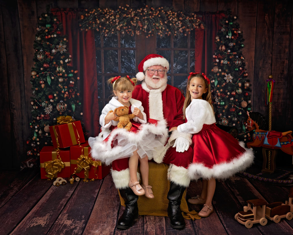 Two sisters with their family meet Father Christmas on the Wirral